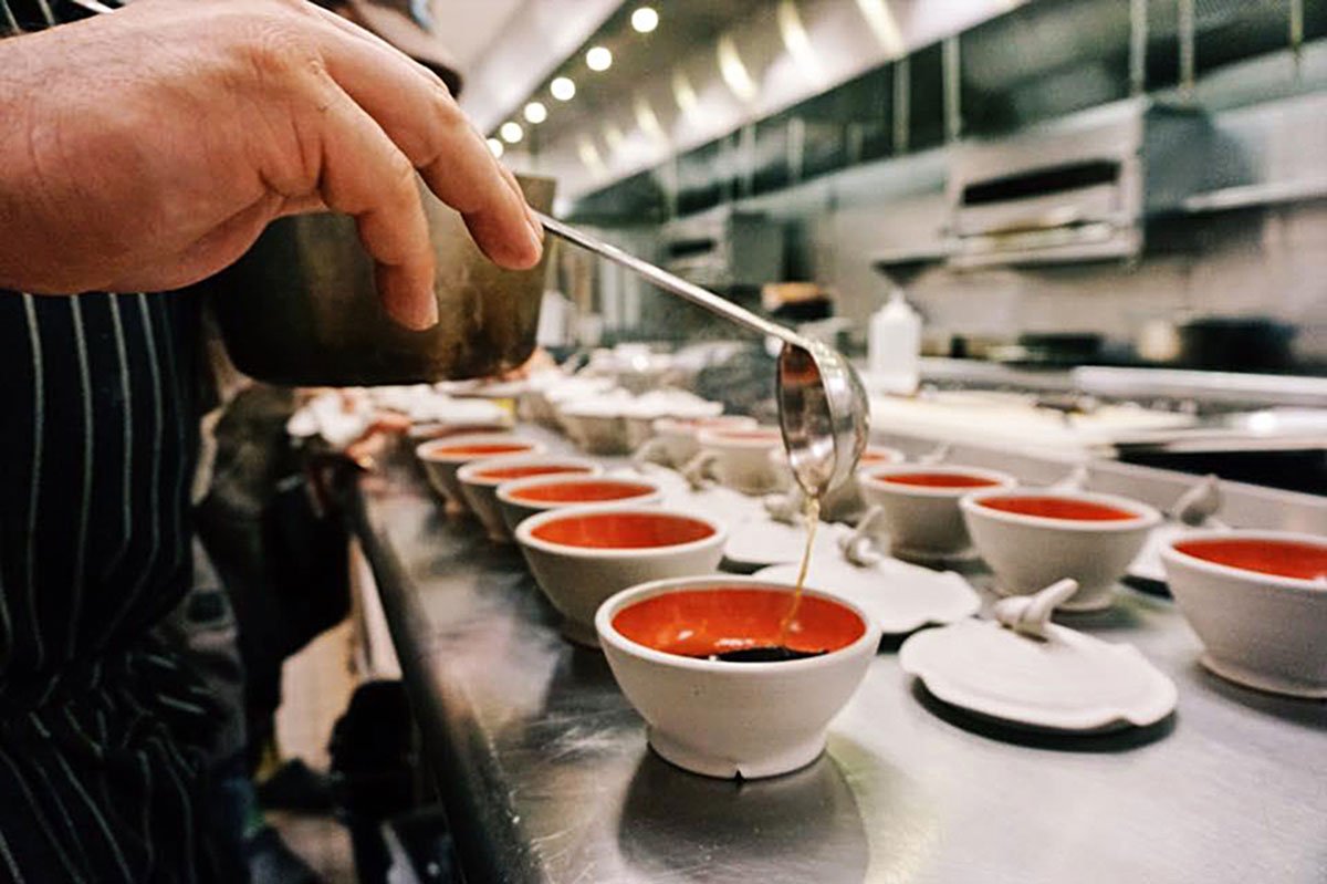 Leak ash dumplings being prepared for service. Steamer pots by Tim Compton, 5 in. diameter each, wheel-thrown Cone 10 stoneware. Photograph by Audra Sternberg, 2017. Leak ash dumplings being prepared for service. Steamer pots by Tim Compton, 5 in. diameter each, wheel-thrown Cone 10 stoneware. Photograph by Audra Sternberg, 2017.