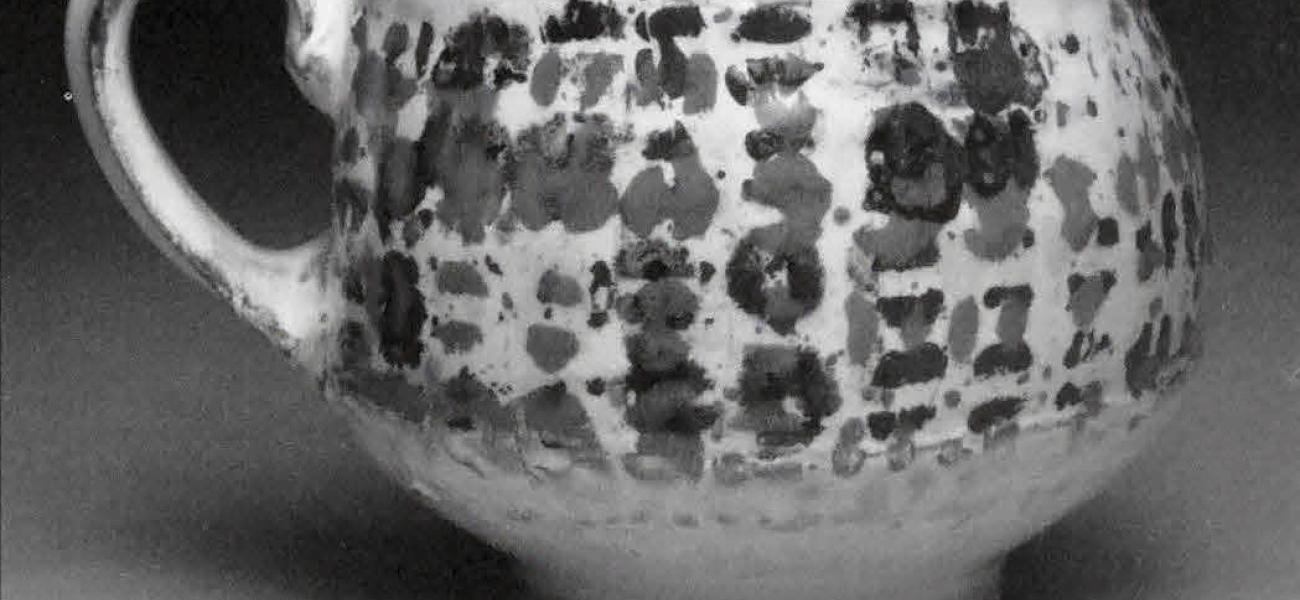 Cup, 2010. Earthenware, slip, toner resist transfer, glaze. 4 x 4 x 4 in.