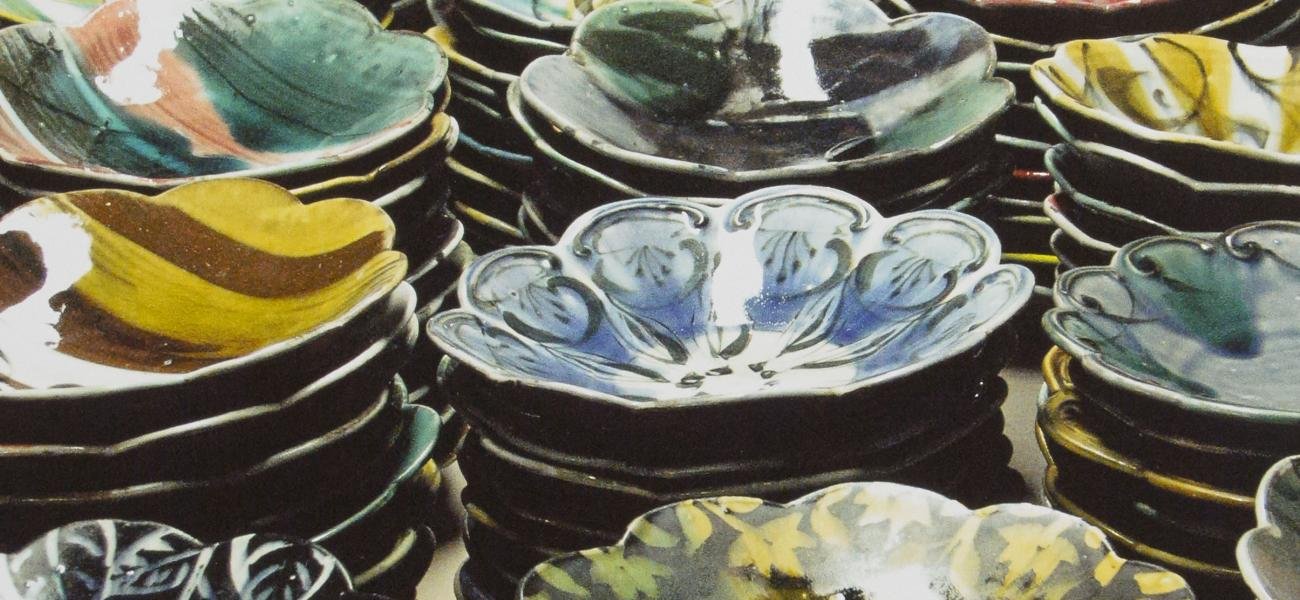 Sean O'Connell. Salad Days Plates, greenware (rear), glazed earthenware (front), 2009.