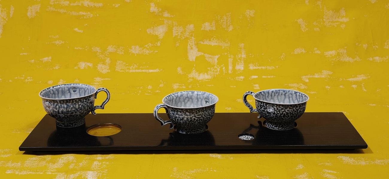Work from "Cup Board" by Steve Harrison, photograph by Richard Cannon