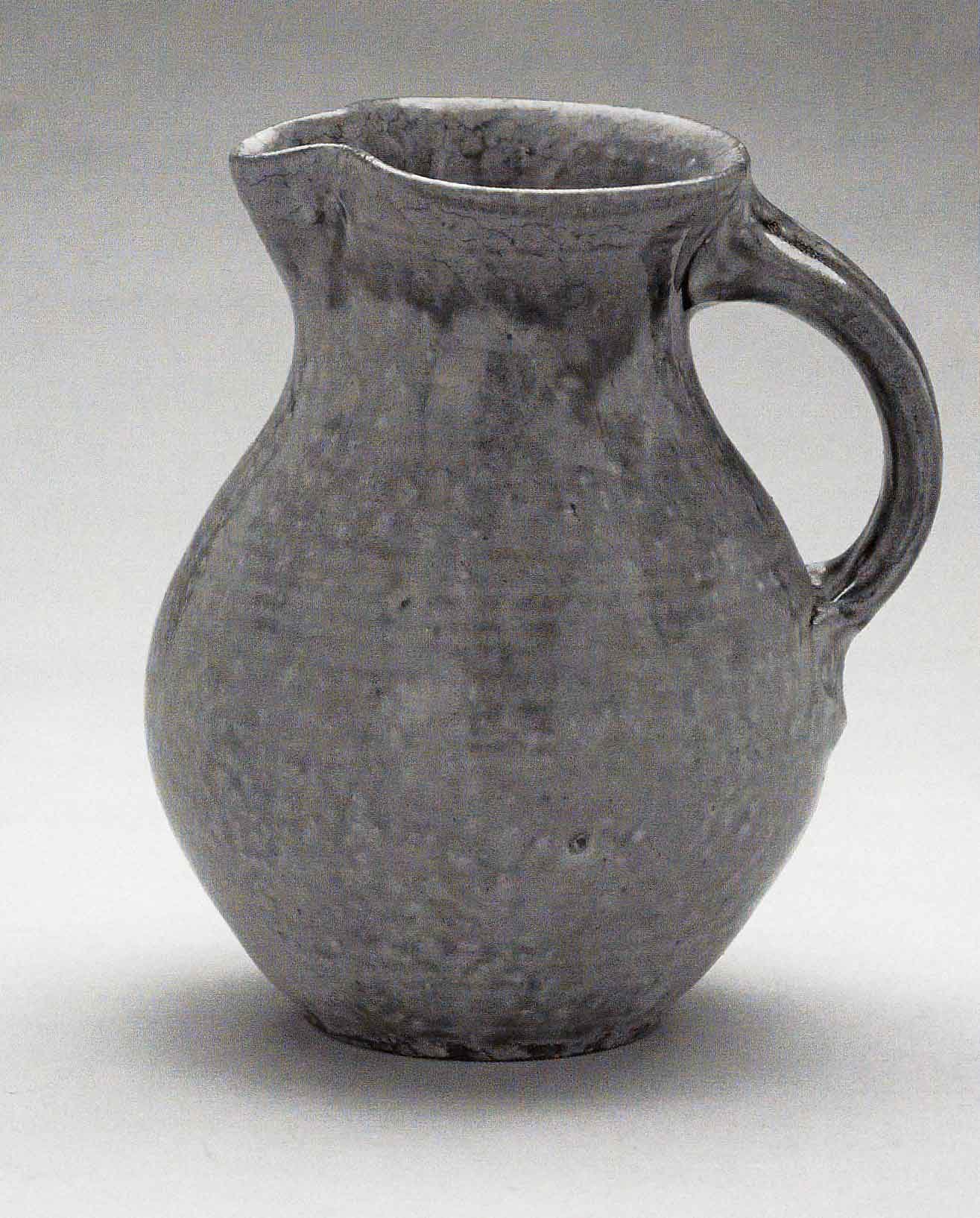 Jug, March 2005. Cone 10 woodfired stoneware, ash glaze over porcelain slip. H 7.5" x W 6". Photograph by VanZandenbergen. Jug, March 2005. Cone 10 woodfired stoneware, ash glaze over porcelain slip. H 7.5" x W 6". Photograph by VanZandenbergen.