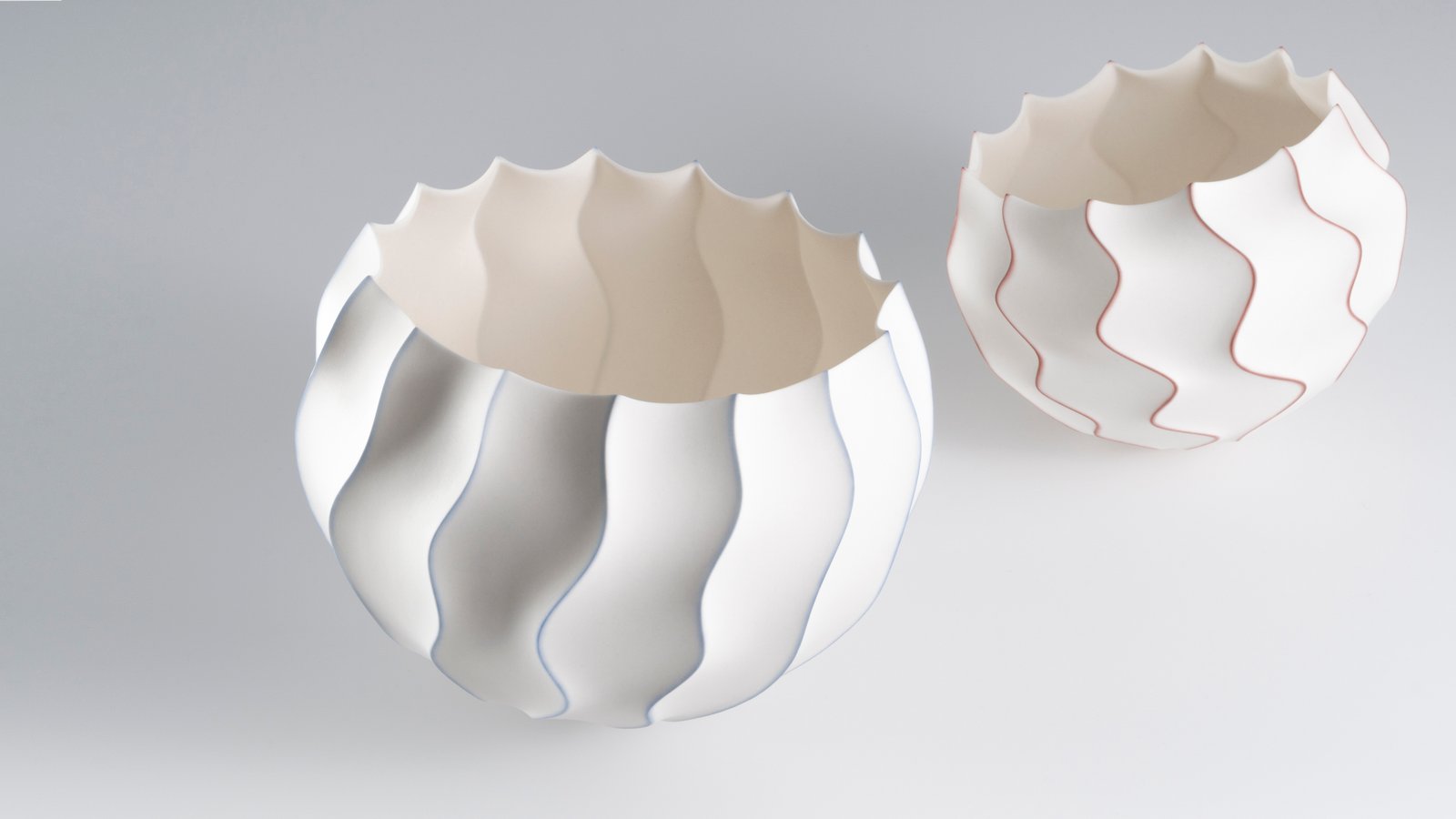 Mark Goudy, Waveform Objects (#1359 & #1356), slip-cast unglazed porcelain + soluble metal salts (gold & cobalt).