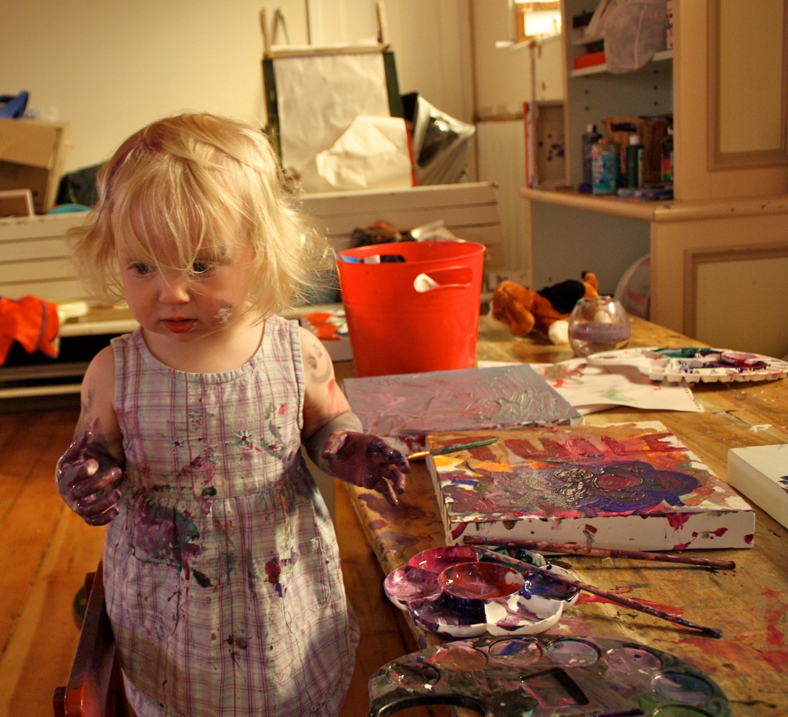 Young Tuile working hard at art camp, show her love of exuberant mark making early. Photo credit: Carrie Whalen