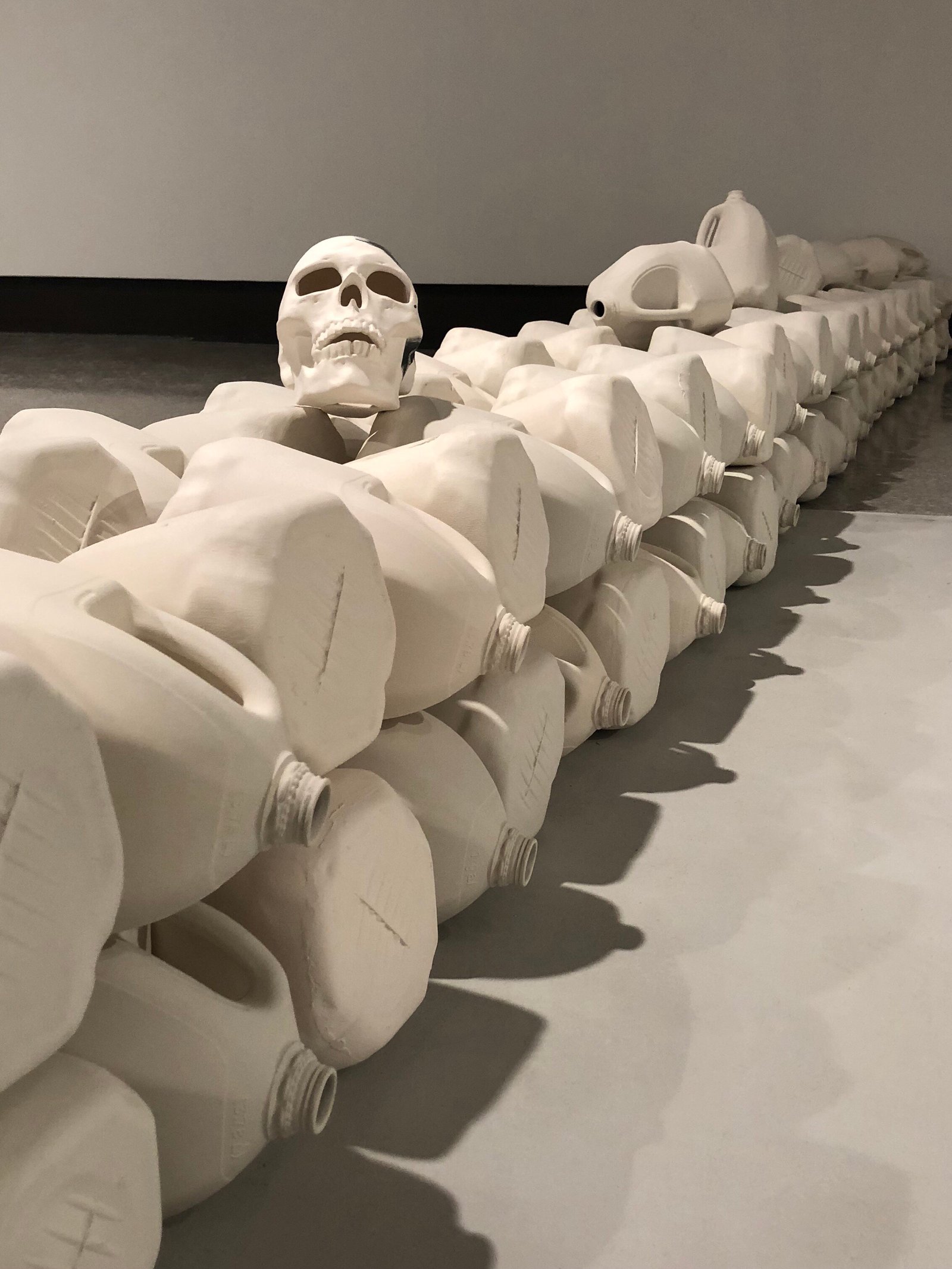 Juan Barroso. 263 Deaths at the Border in 1999 – Porcelain, underglaze, fired to cone six in oxidation atmosphere, 18 x 18 x 330 inches. Photo credit: Barroso.