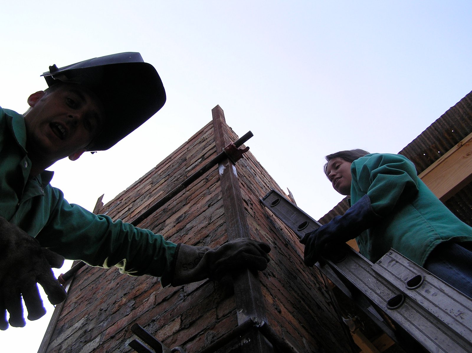 Andrew and Heidi Casto welding chimney in Iowa, 2008.