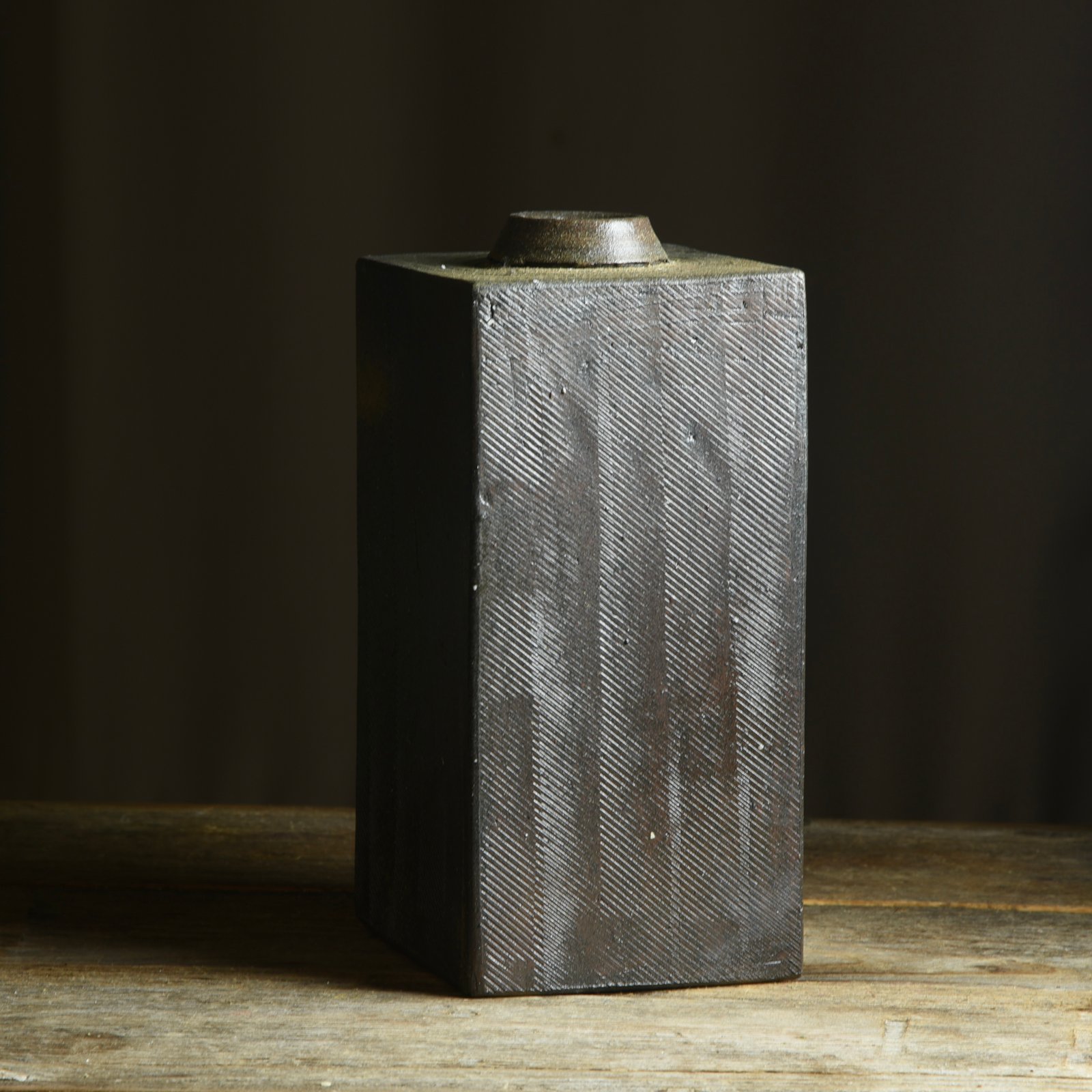 Stamped slab bottle, by Kate Gibbs, showing strong reduction cooling effects on the local clay. 