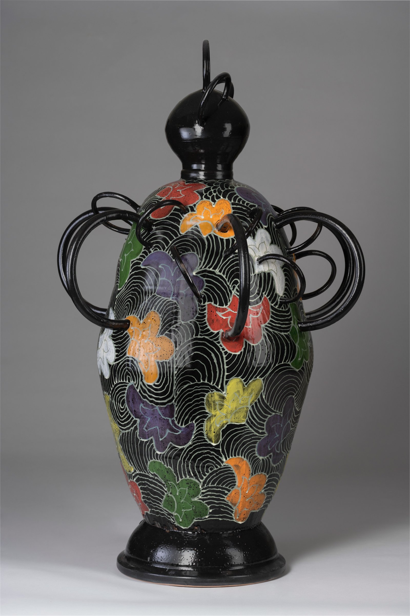 Emmanuel Okechukwu, “Uzoma (The Good Part)”, 2025, Ceramic, wheel-thrown and extruded rings, cone 04 clay, majolica glaze and underglaze, 48” × 16” × 11”.
