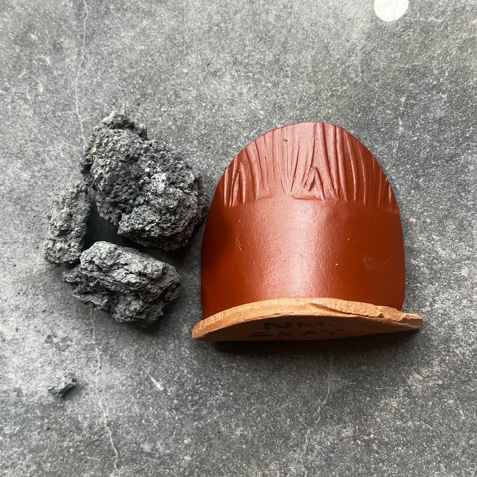 New Mexico Gray. A gray clay from the mountains of New Mexico that fires bright red.