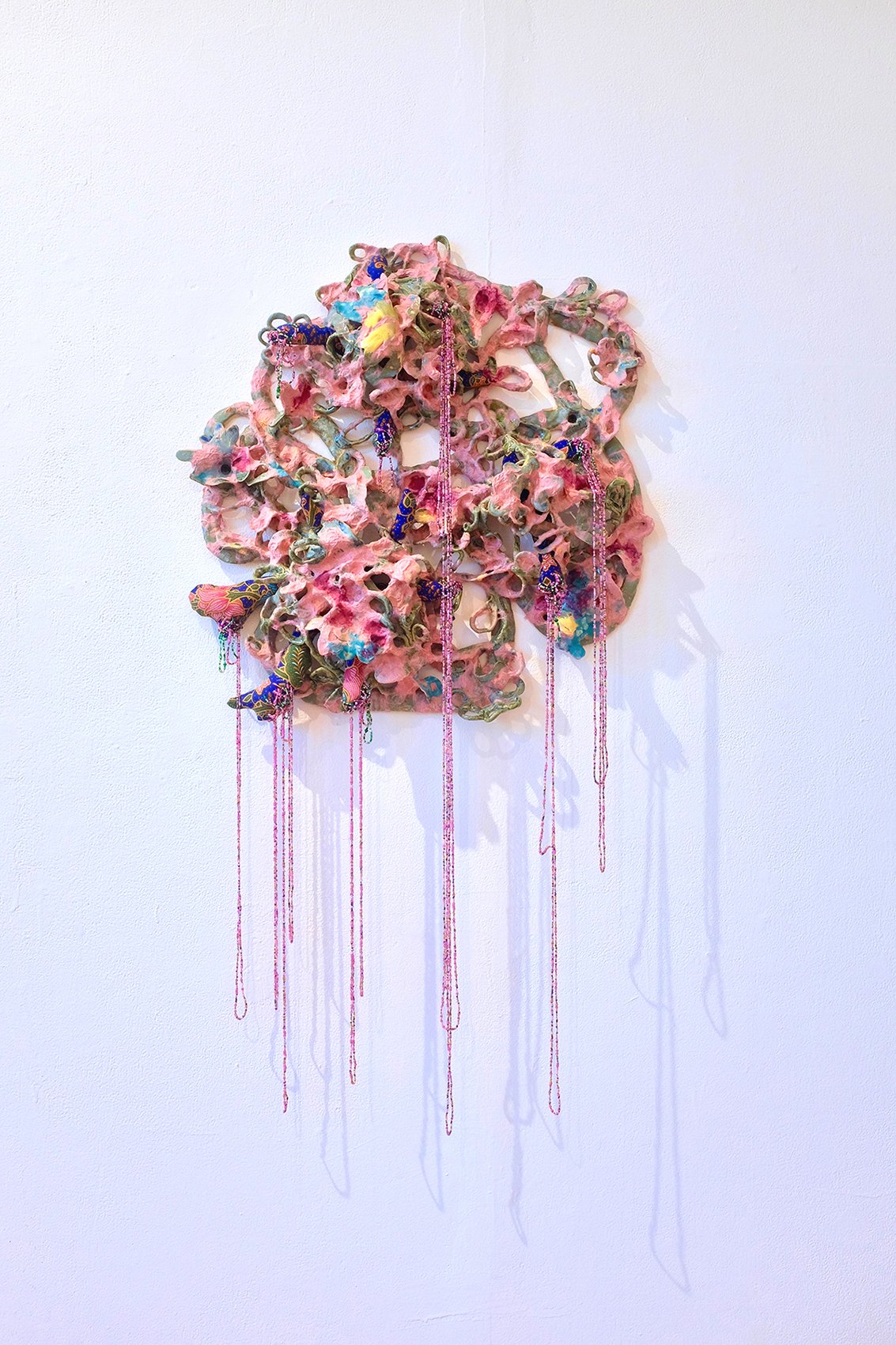 “Labor of Ornament,” glazed Ceramic, kozo, batik, beads, 2021